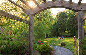 Couple enjoying a glass of wine in the gardens