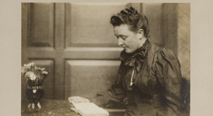 Old photo of a woman reading a book