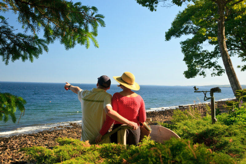 Couple looking out at the water from Inn at Sunrise Point grounds