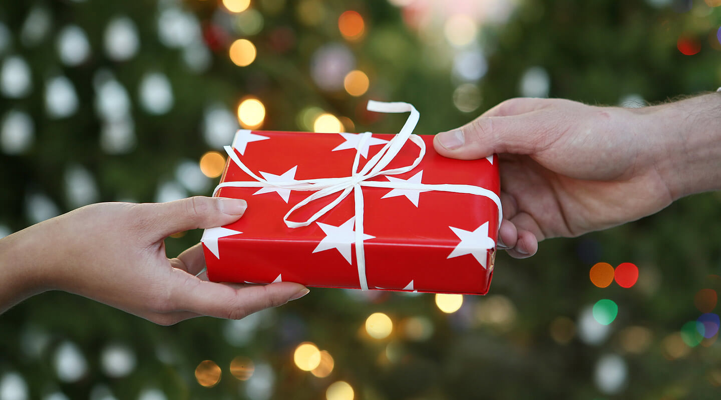 Gift being exchanged between two people