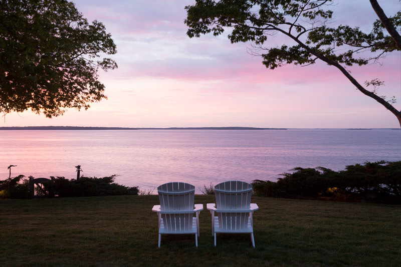 two chairs pointed at Maine sunrise view